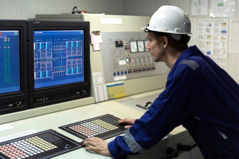 Young,Engineer,In,A,Cargo,Control,Room,Of,A,Oil